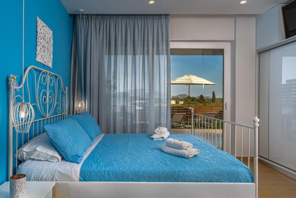 Postel nebo postele na pokoji v ubytování Magnolia Homes Zakynthos