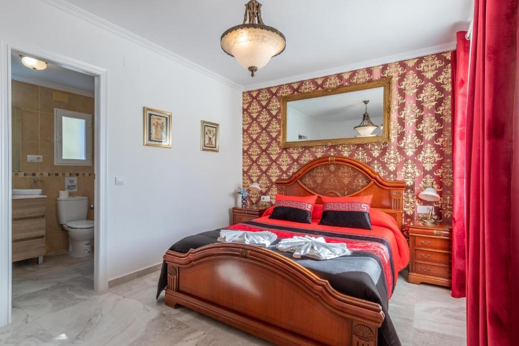 A bed or beds in a room at Villa Galicia