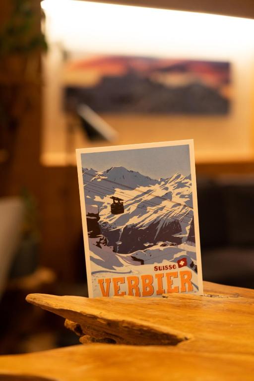 a sign sitting on top of a table at Hotel Les Chamois in Verbier