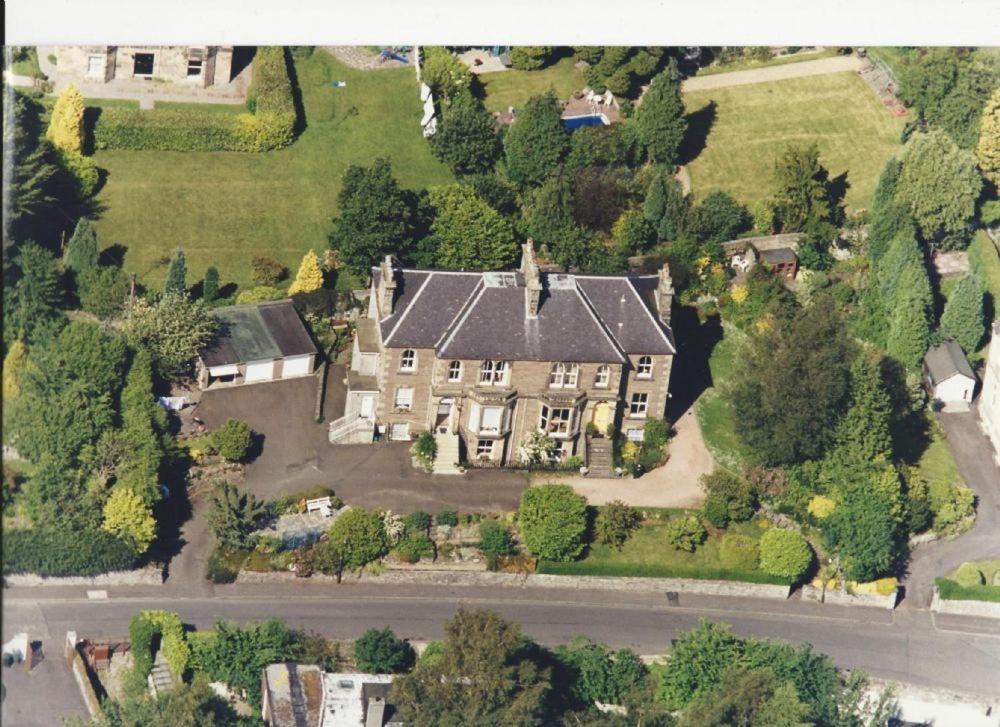 an aerial view of a large house with at Allan Stream Apartment in Bridge of Allan
