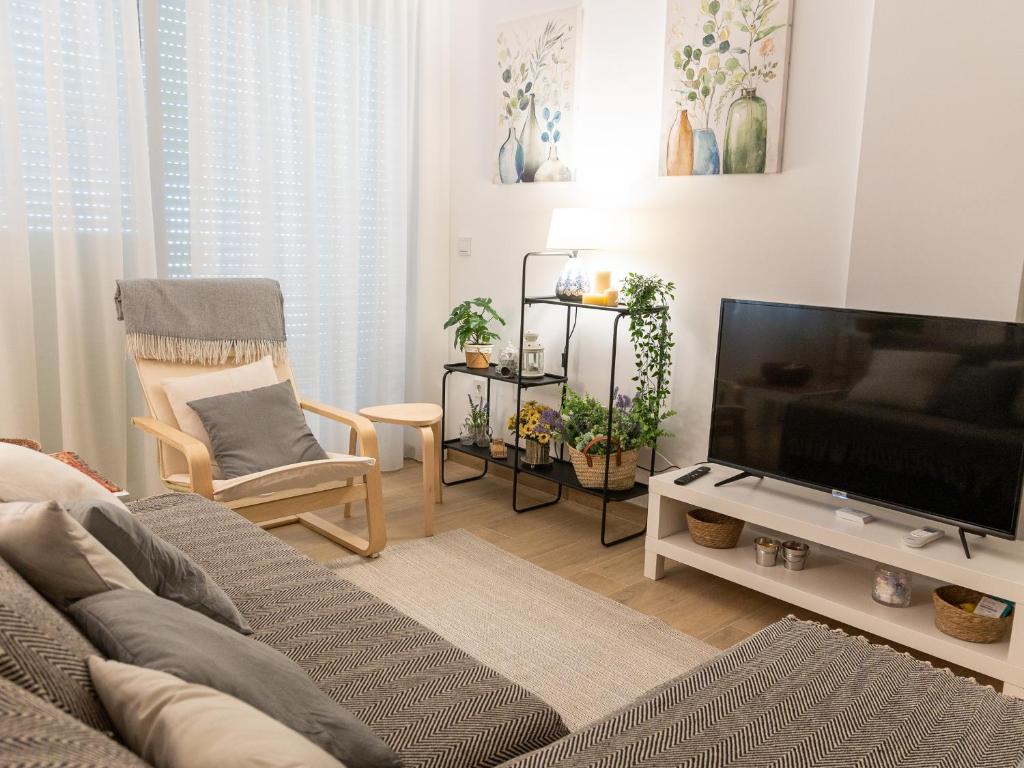 Televízia a/alebo spoločenská miestnosť v ubytovaní La Casa de Nano