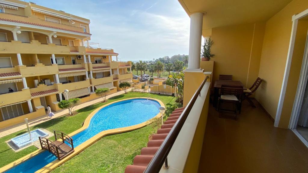 a view from the balcony of a apartment building with a swimming pool at Cascada de las Marinas in Denia