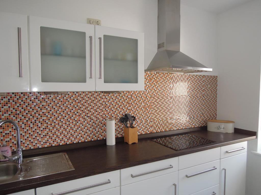 Kuchyň nebo kuchyňský kout v ubytování Ferienwohnung Nordluft