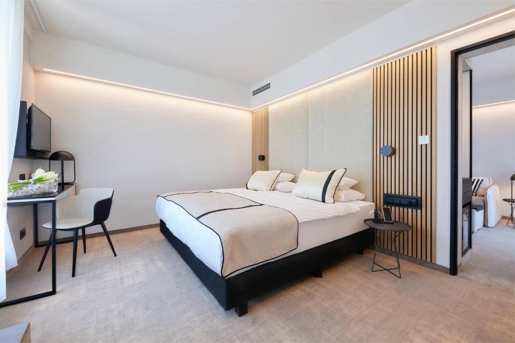 A bed or beds in a room at LUA Resort - Adults only