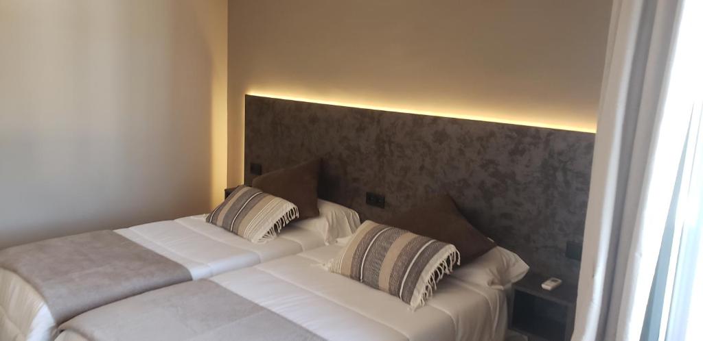 Postel nebo postele na pokoji v ubytování Hotel Balfagón
