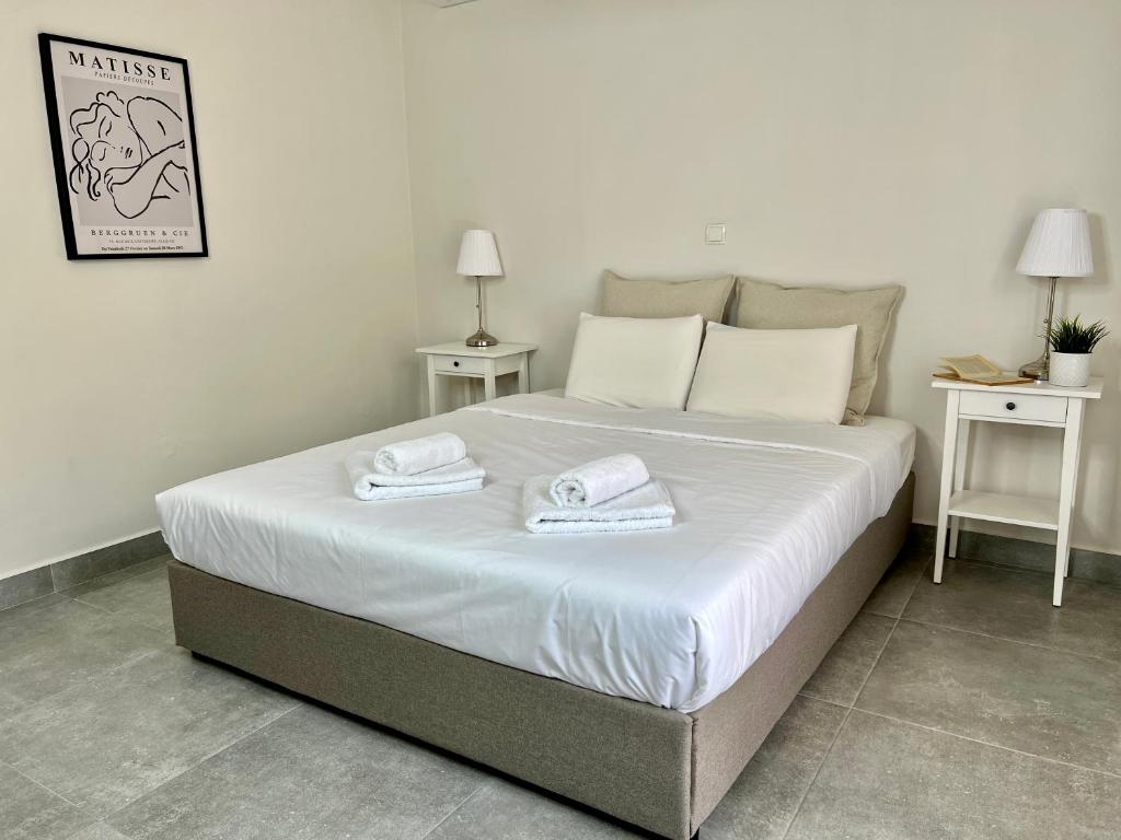 Postel nebo postele na pokoji v ubytování PETRA RESIDENCES IN LINDOS