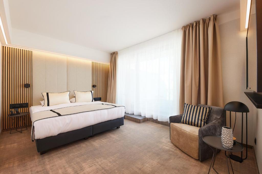 A bed or beds in a room at LUA Resort - Adults only