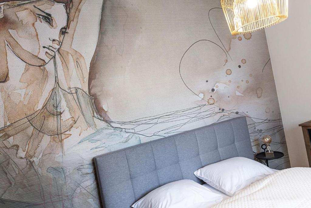 A bed or beds in a room at Apartments Traunkai Bad Ischl