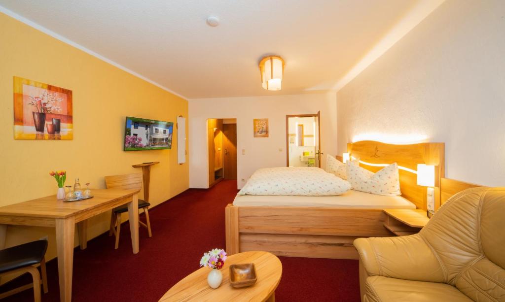 Voodi või voodid majutusasutuse Rennsteighotel Grüner Baum toas