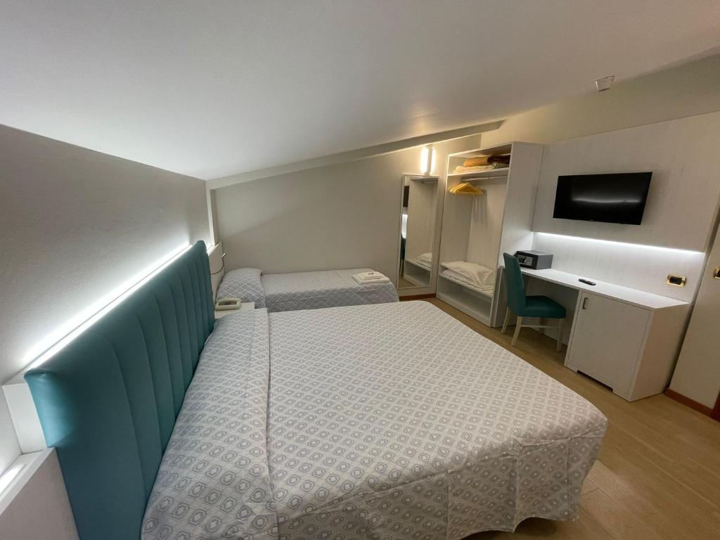 TV a/nebo společenská místnost v ubytování Hotel Corallo