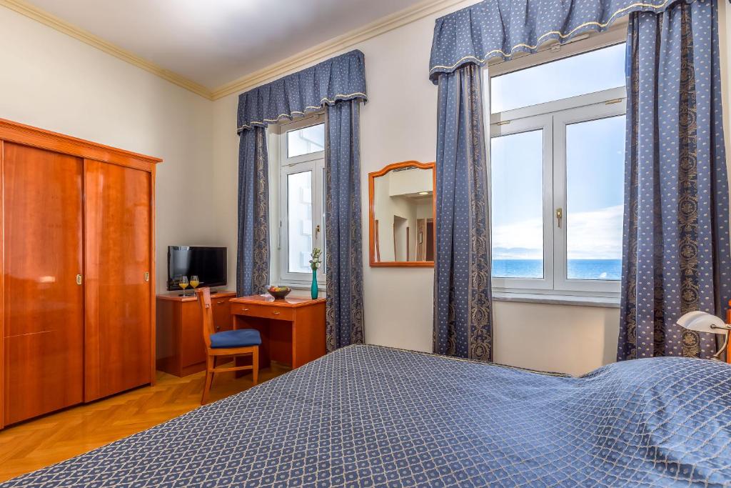 Postel nebo postele na pokoji v ubytování Hotel Galeb