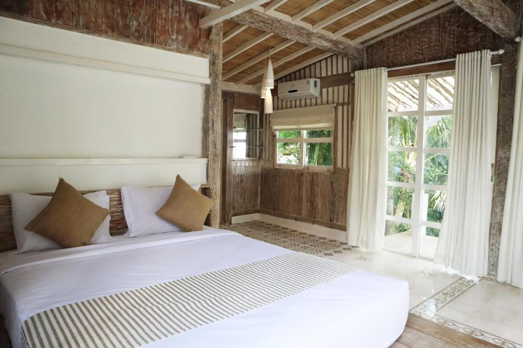 Postel nebo postele na pokoji v ubytování Aventus Resort Ubud