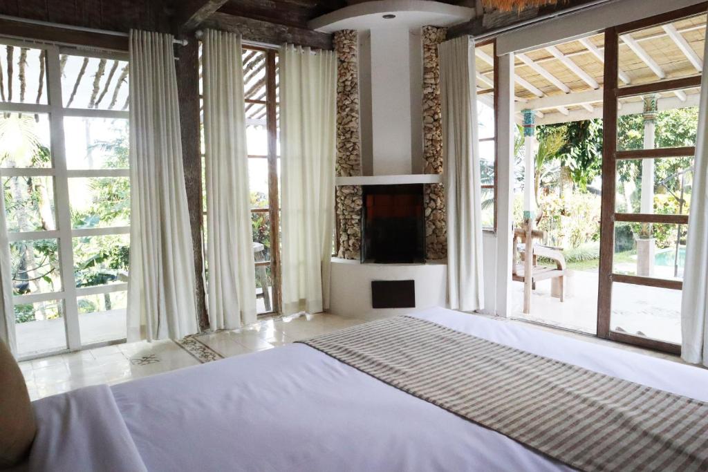 Postel nebo postele na pokoji v ubytování Aventus Resort Ubud