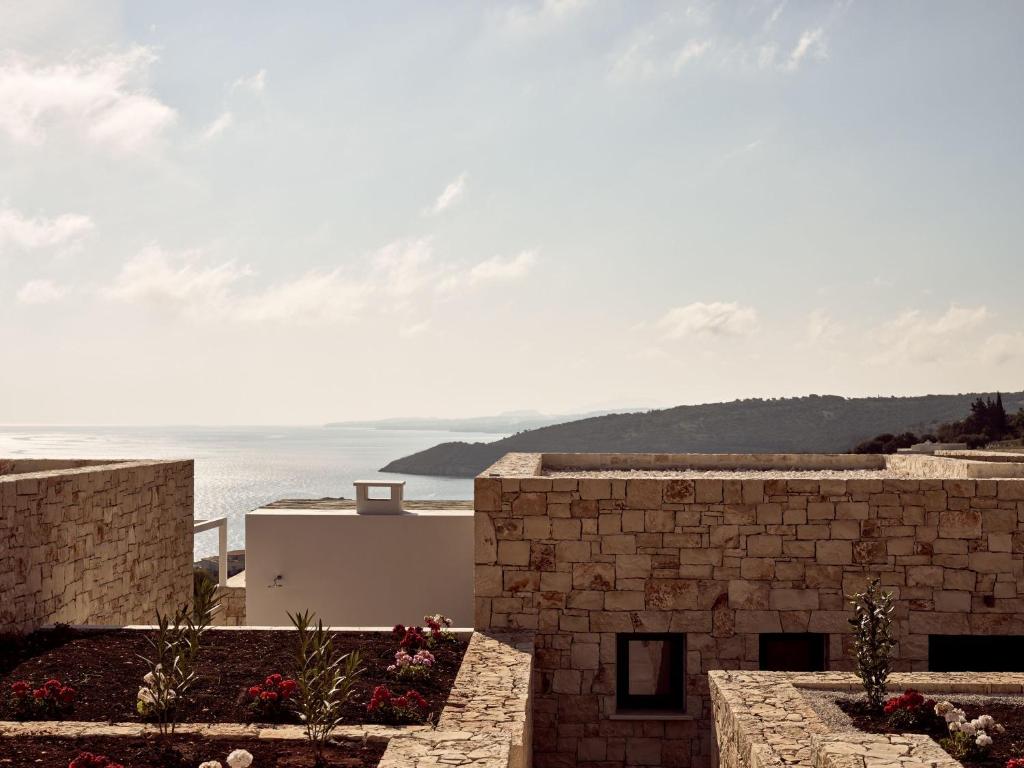 a view of the ocean from a building at The Sall Suites Complex A - Iconic Sea Views, by ZanteWize in Agios Nikolaos