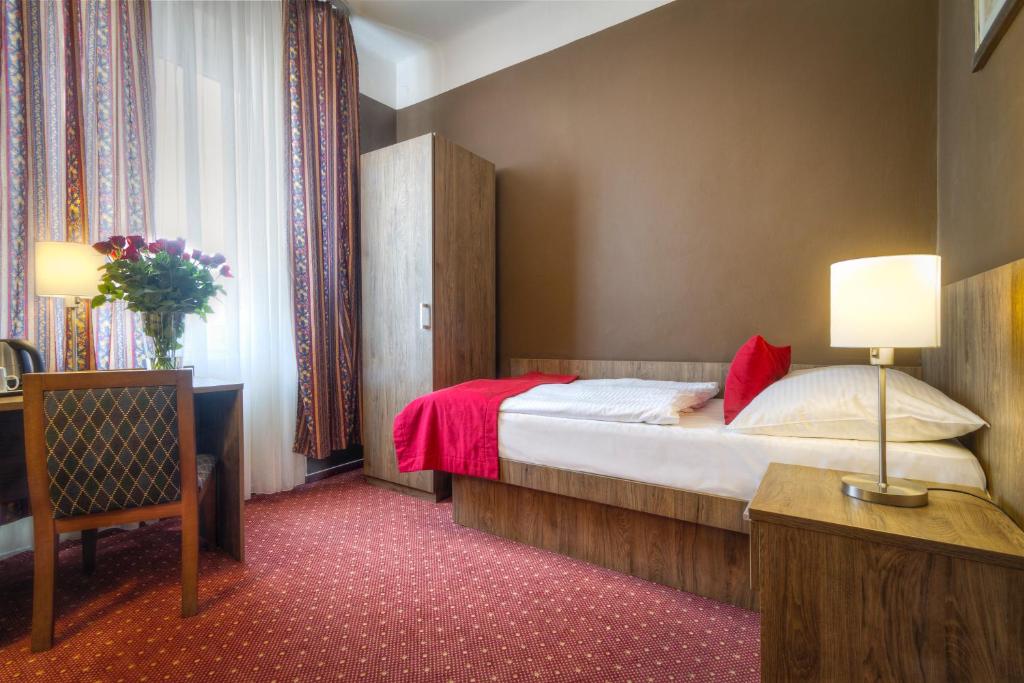 Postel nebo postele na pokoji v ubytování Hotel Harmony