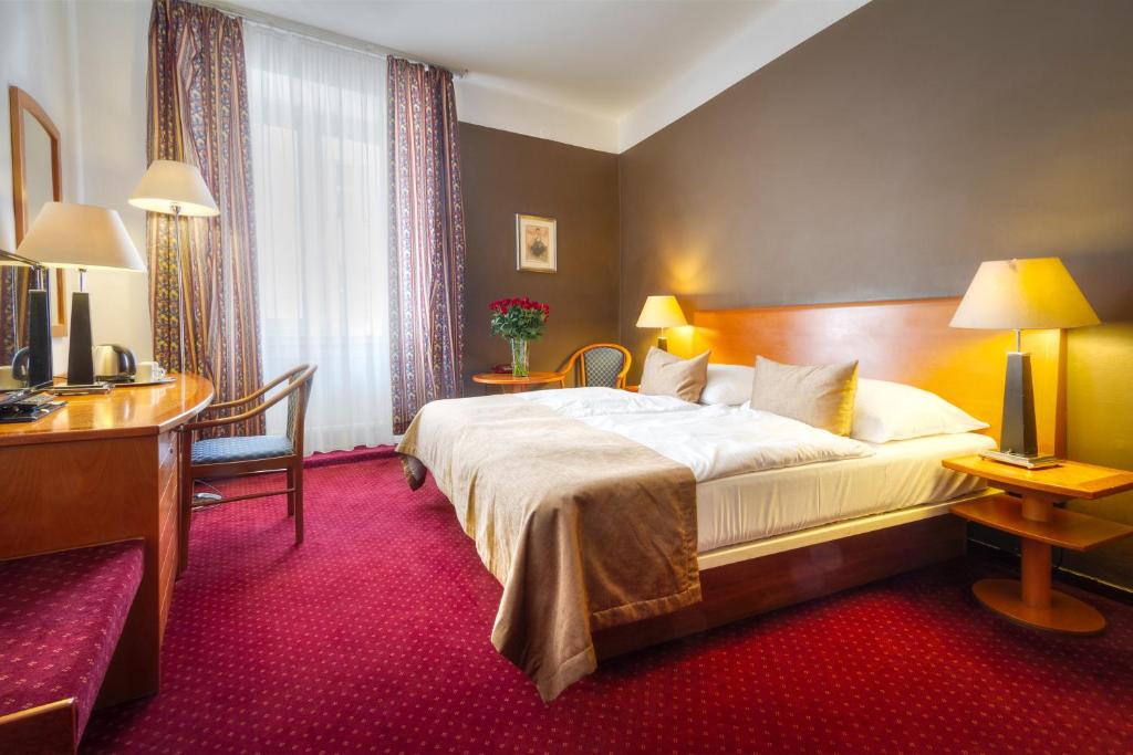 Postel nebo postele na pokoji v ubytování Hotel Harmony