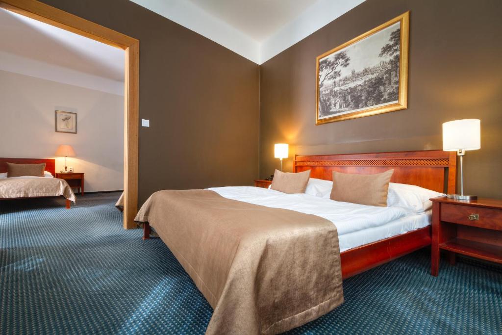 Postel nebo postele na pokoji v ubytování Hotel Harmony