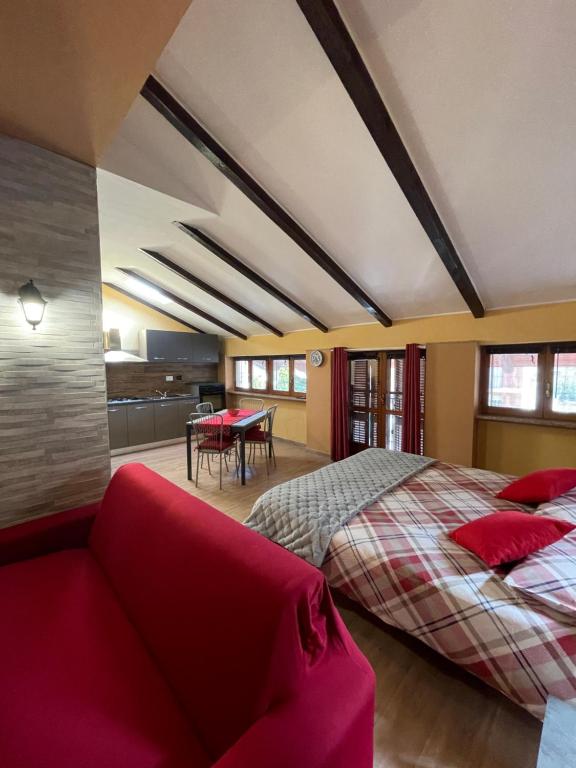 A bed or beds in a room at 'La Buffa', Elegante appartamento a Giaveno by ConfirentHouse