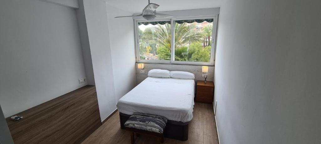 A bed or beds in a room at San Juan Live