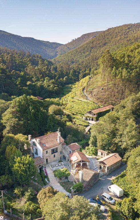 an aerial view of a house in a valley at Entre Os Ríos - Casa Rural y Enoturismo in A Pobra do Caramiñal