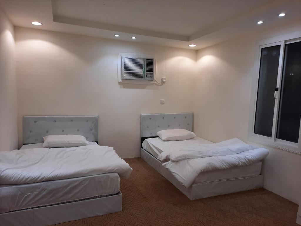 Ένα ή περισσότερα κρεβάτια σε δωμάτιο στο مزرعة ارياف العلا