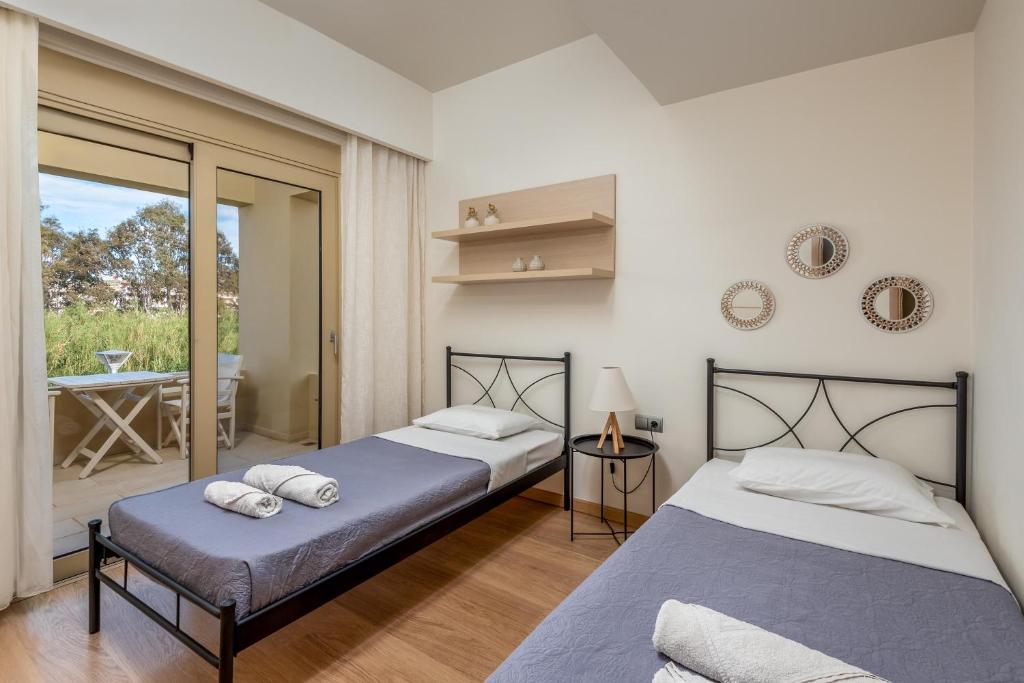 Postel nebo postele na pokoji v ubytování Vasiliki Villa