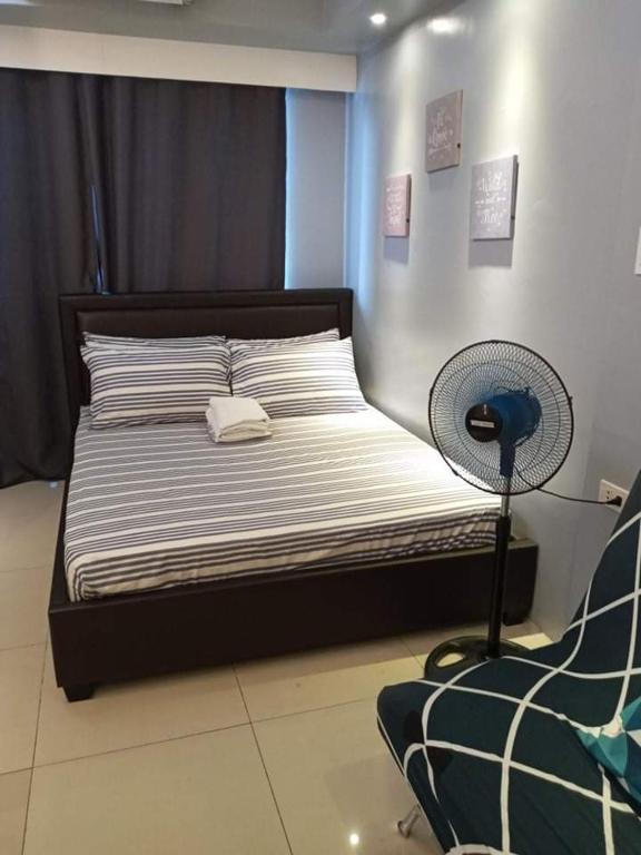Postel nebo postele na pokoji v ubytování LIAM's Staycation