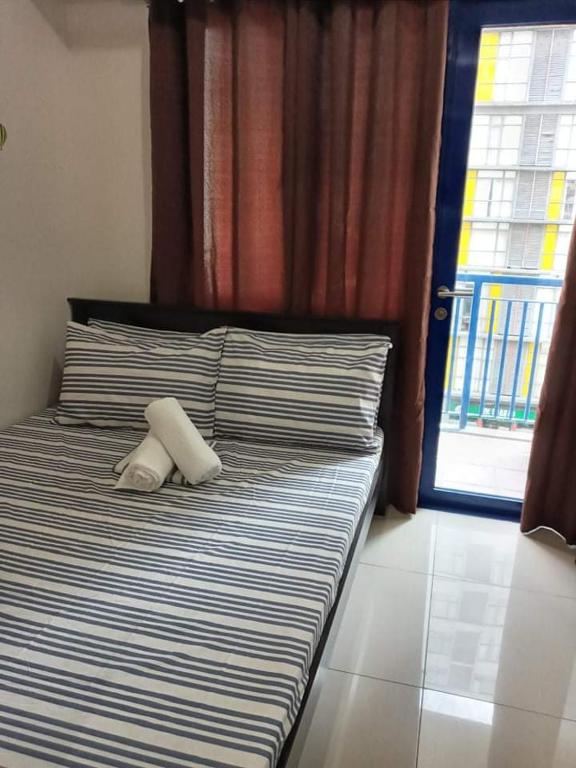 Postel nebo postele na pokoji v ubytování LIAM's Staycation