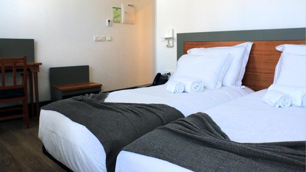 Postel nebo postele na pokoji v ubytování Aliança café & hostel