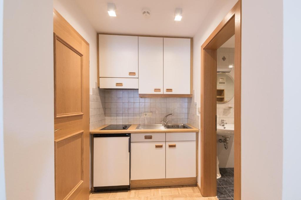 Kuchyň nebo kuchyňský kout v ubytování Residence Edelweiss