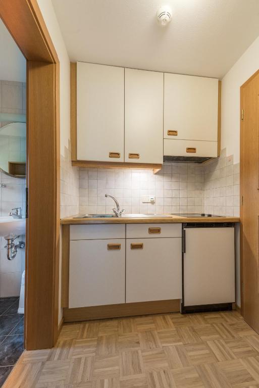 Kuchyň nebo kuchyňský kout v ubytování Residence Edelweiss