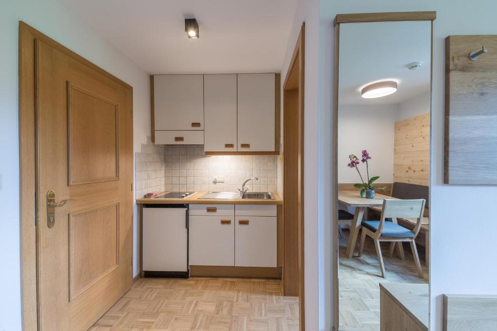Kuchyň nebo kuchyňský kout v ubytování Residence Edelweiss