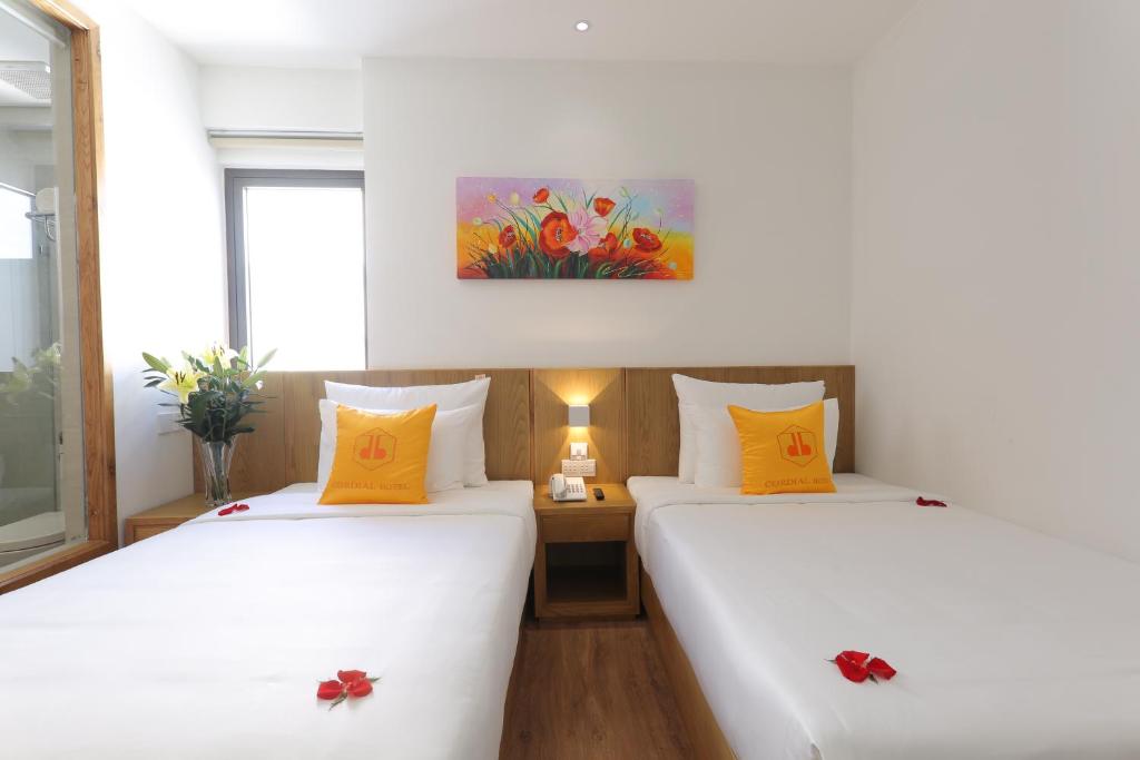 Postel nebo postele na pokoji v ubytování Cordial Beach Hotel Da Nang