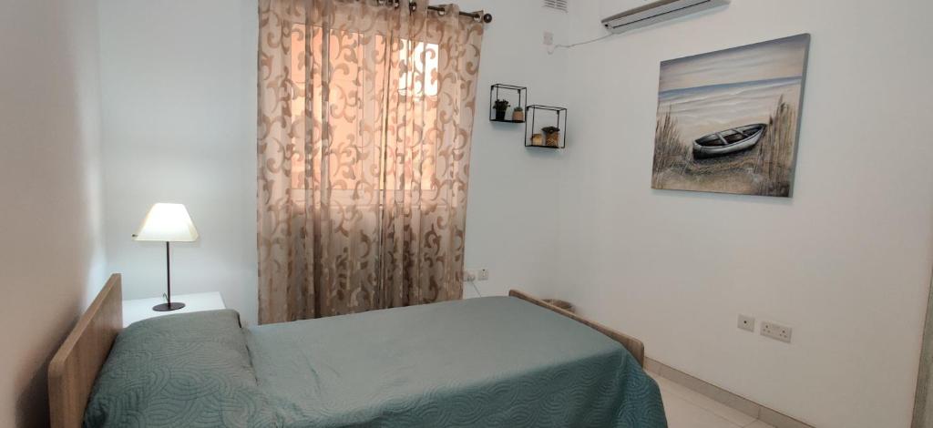 Letto o letti in una camera di Lorenza Letting Maisonette