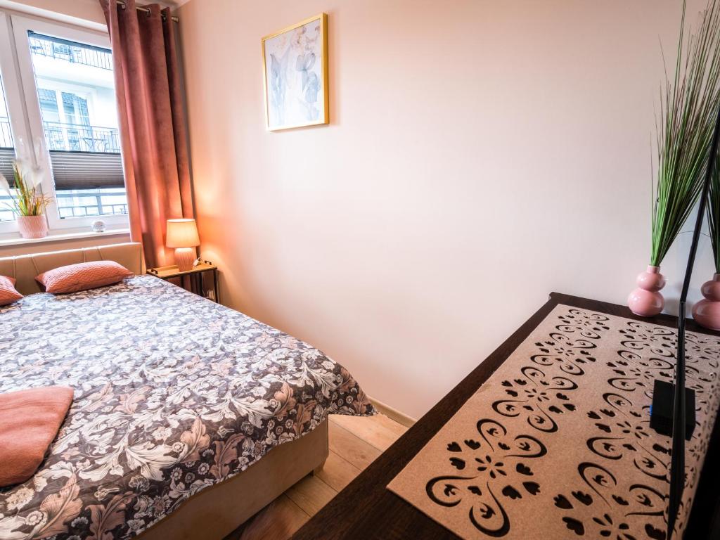 Posteľ alebo postele v izbe v ubytovaní Markowe Apartamenty Złoty Park