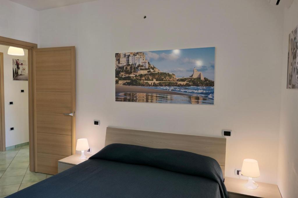Łóżko lub łóżka w pokoju w obiekcie Ganimede Apartament