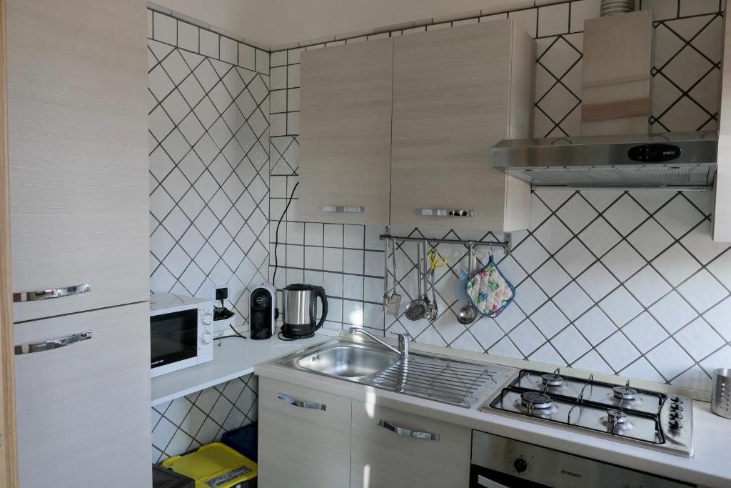 Kuchnia lub aneks kuchenny w obiekcie Ganimede Apartament