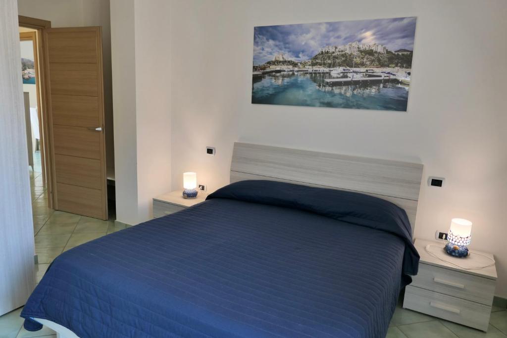 Łóżko lub łóżka w pokoju w obiekcie Ganimede Apartament