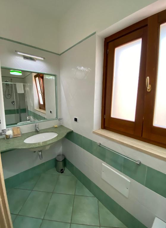 Łazienka w obiekcie Ganimede Apartament