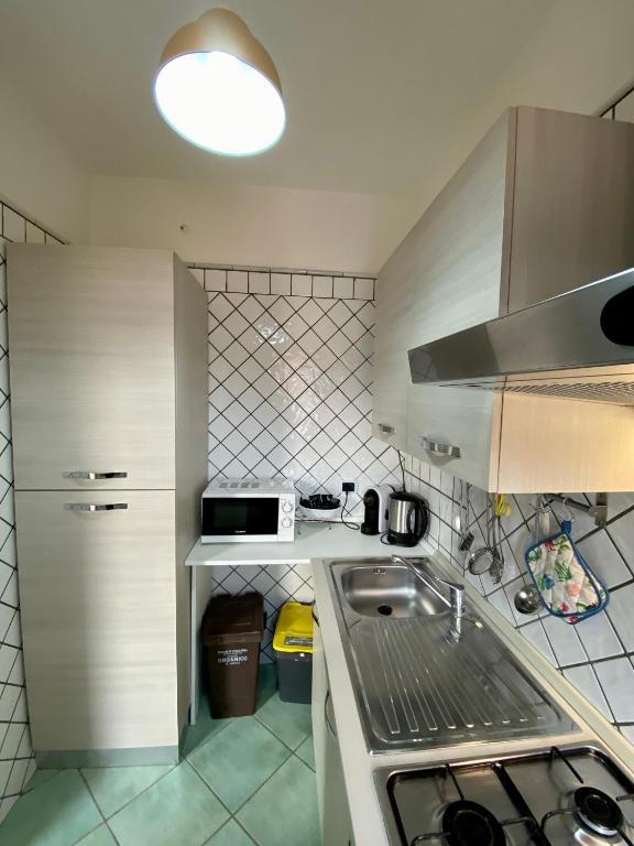 Kuchnia lub aneks kuchenny w obiekcie Ganimede Apartament
