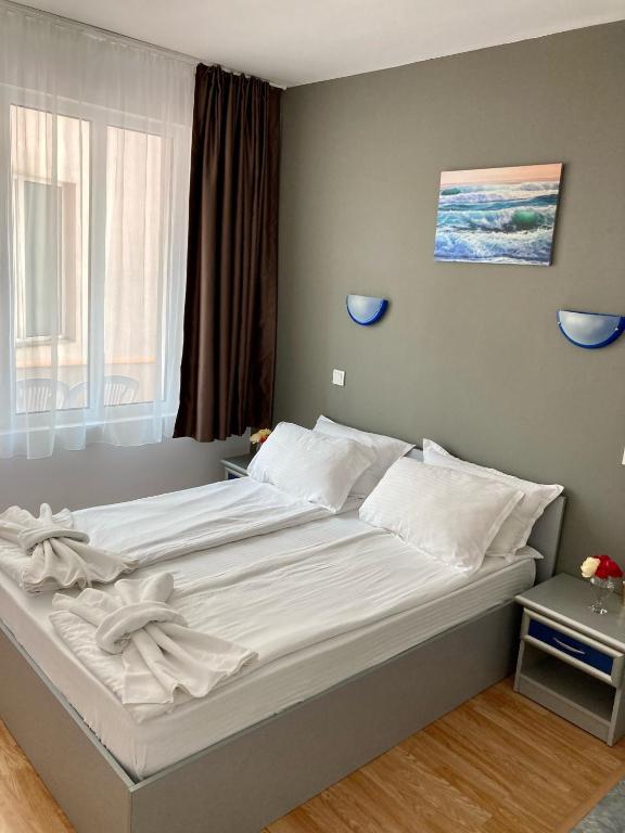 Postel nebo postele na pokoji v ubytování Plovdiv Hotel