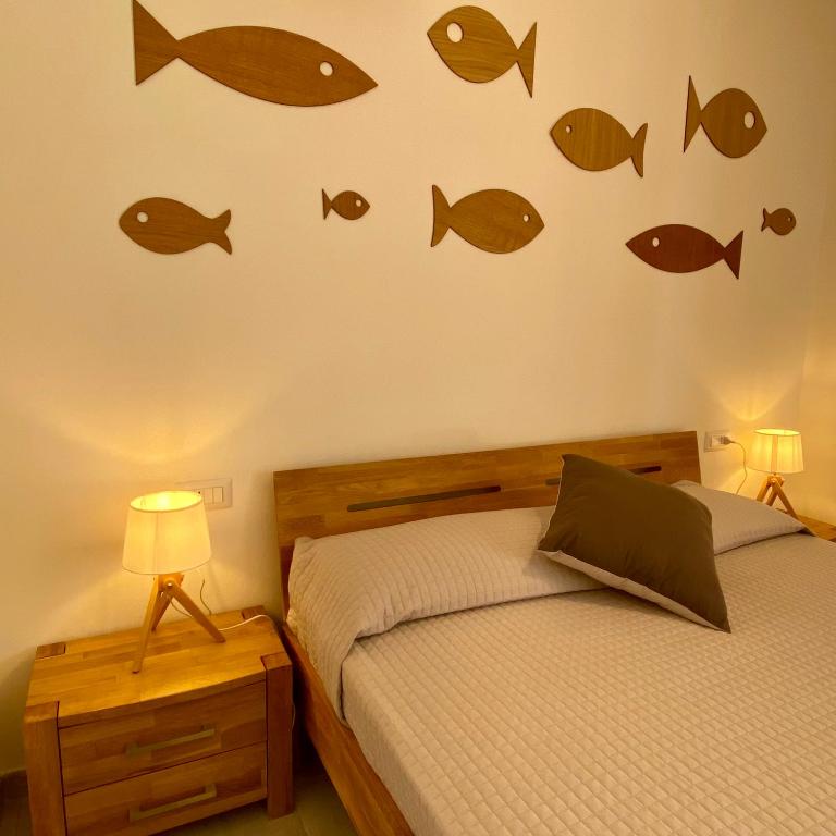 Posteľ alebo postele v izbe v ubytovaní SeaSun Guest House Alghero