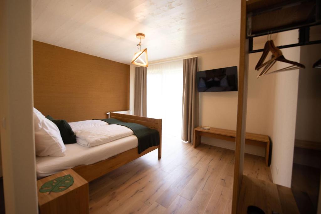 Postel nebo postele na pokoji v ubytování Monschein Weingut Straden