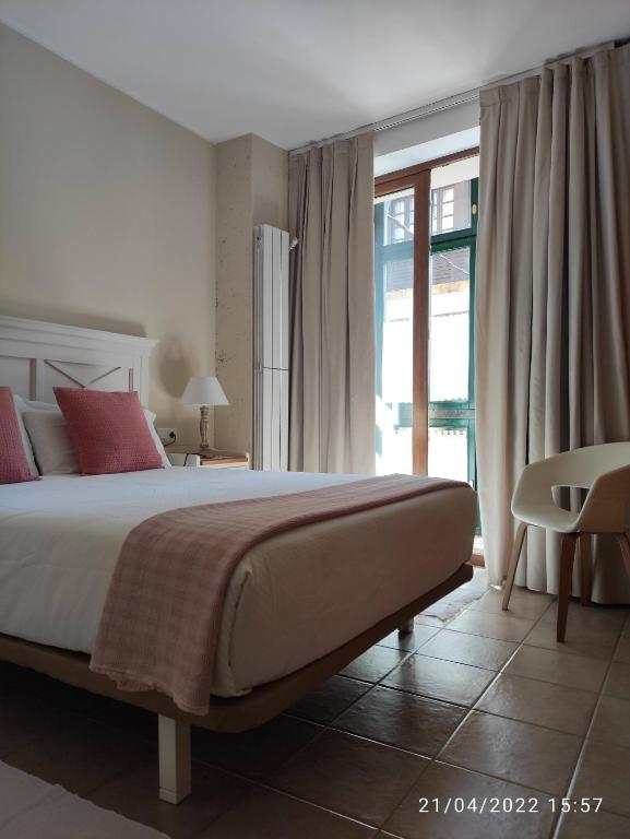 Postel nebo postele na pokoji v ubytování Apartamento Campomanes
