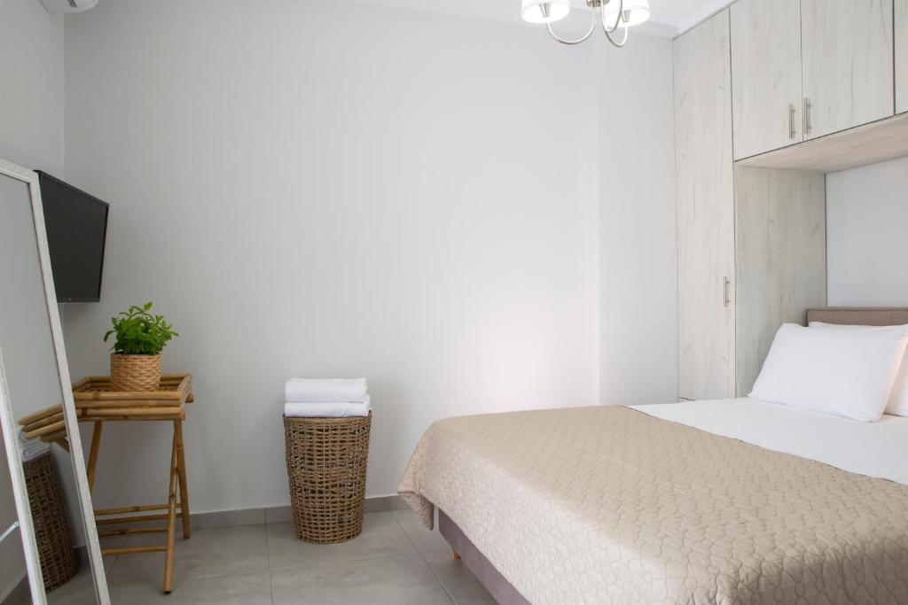 A bed or beds in a room at The Lefkadian collection G and N