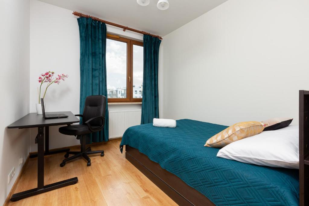 Posteľ alebo postele v izbe v ubytovaní Apartament Na Woli Sowińskiego by Noclegi Renters
