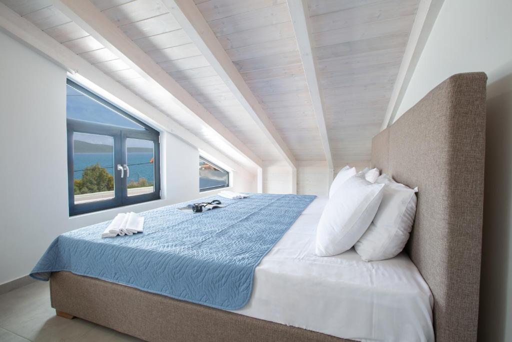 A bed or beds in a room at The Lefkadian collection G and N