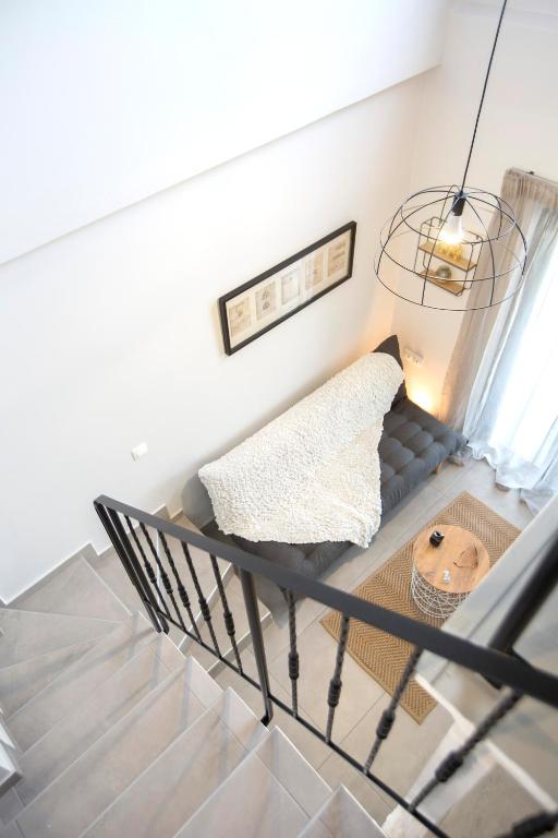 A bed or beds in a room at The Lefkadian collection G and N