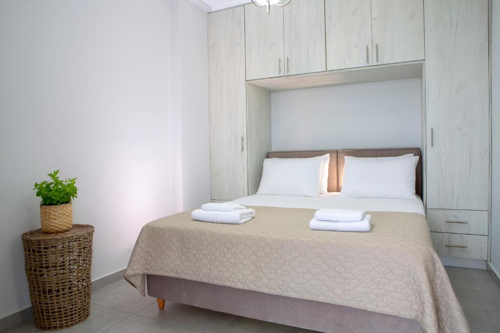 A bed or beds in a room at The Lefkadian collection G and N