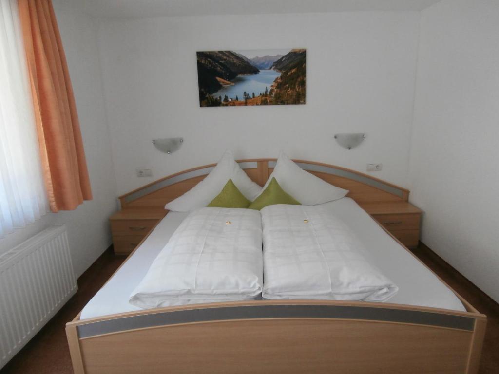 Postel nebo postele na pokoji v ubytování Haus Plankensteiner